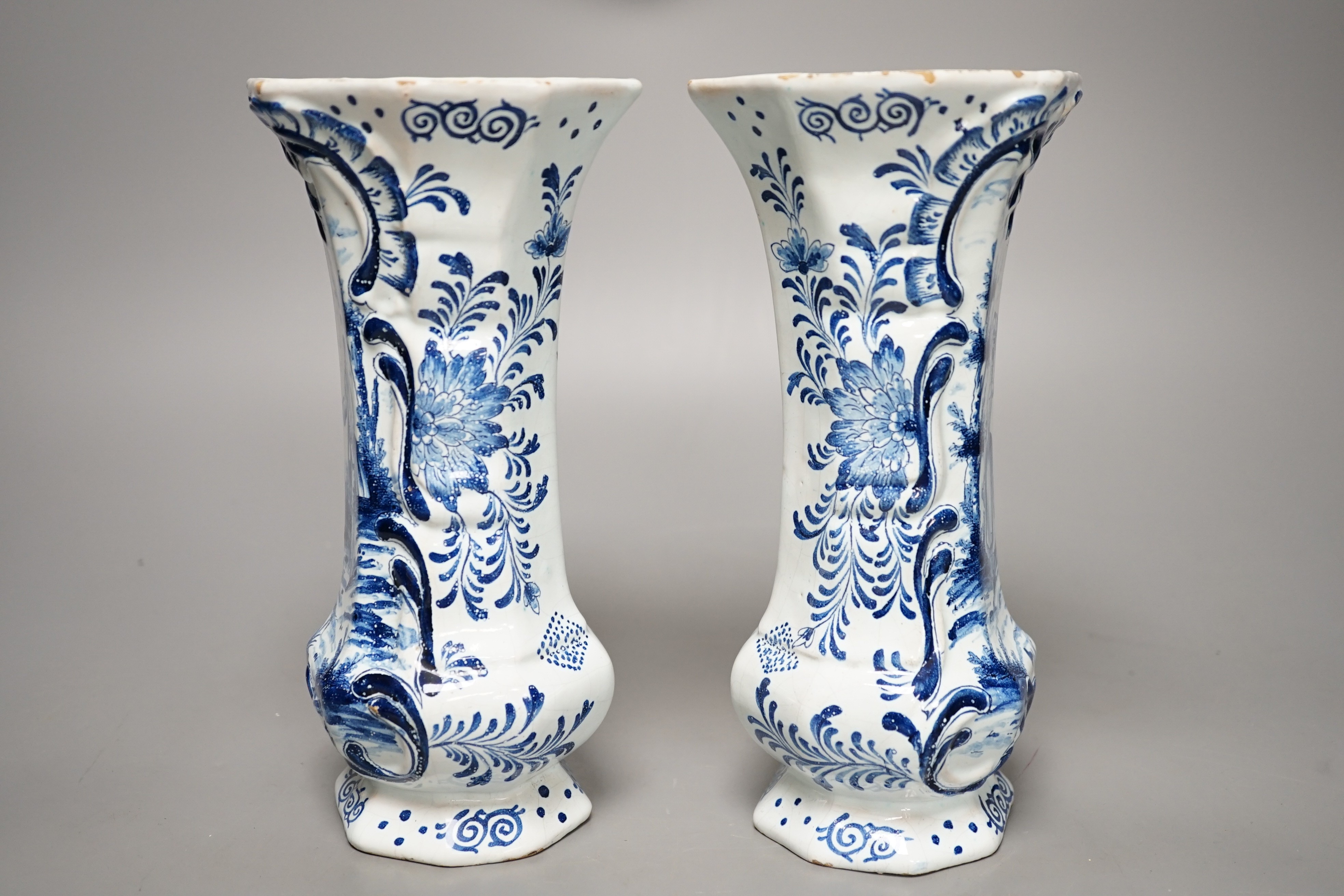 A pair of 19th century Delft blue and white vases 21.5cm